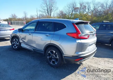 2018 Honda Cr-V Touring z USA, uszkodzony, nr VIN 7FARW2H94JE058771